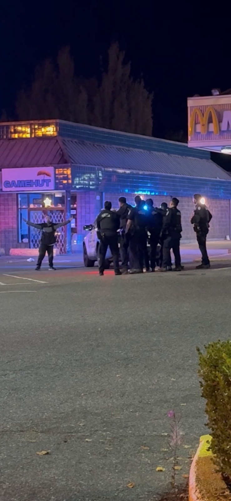 SOUTH SURREY, B.C.: Footage submitted to Breaking News Canada captures the moment police shot a man with a less-lethal round during an alleged knife incident near Semiahmoo Shopping Centre. — Breaking News Canada